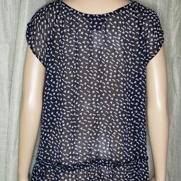 Black and white top. Size L. The brand is Fire and is 100% polyester. - Picture 3 of 4